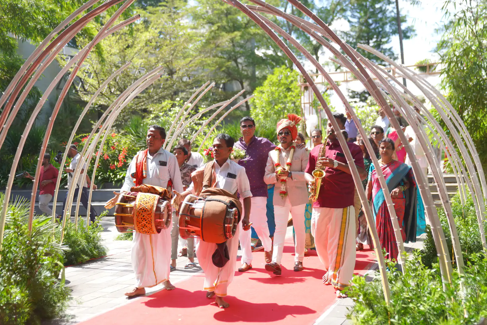 South Indian musicians under a bamboo arch