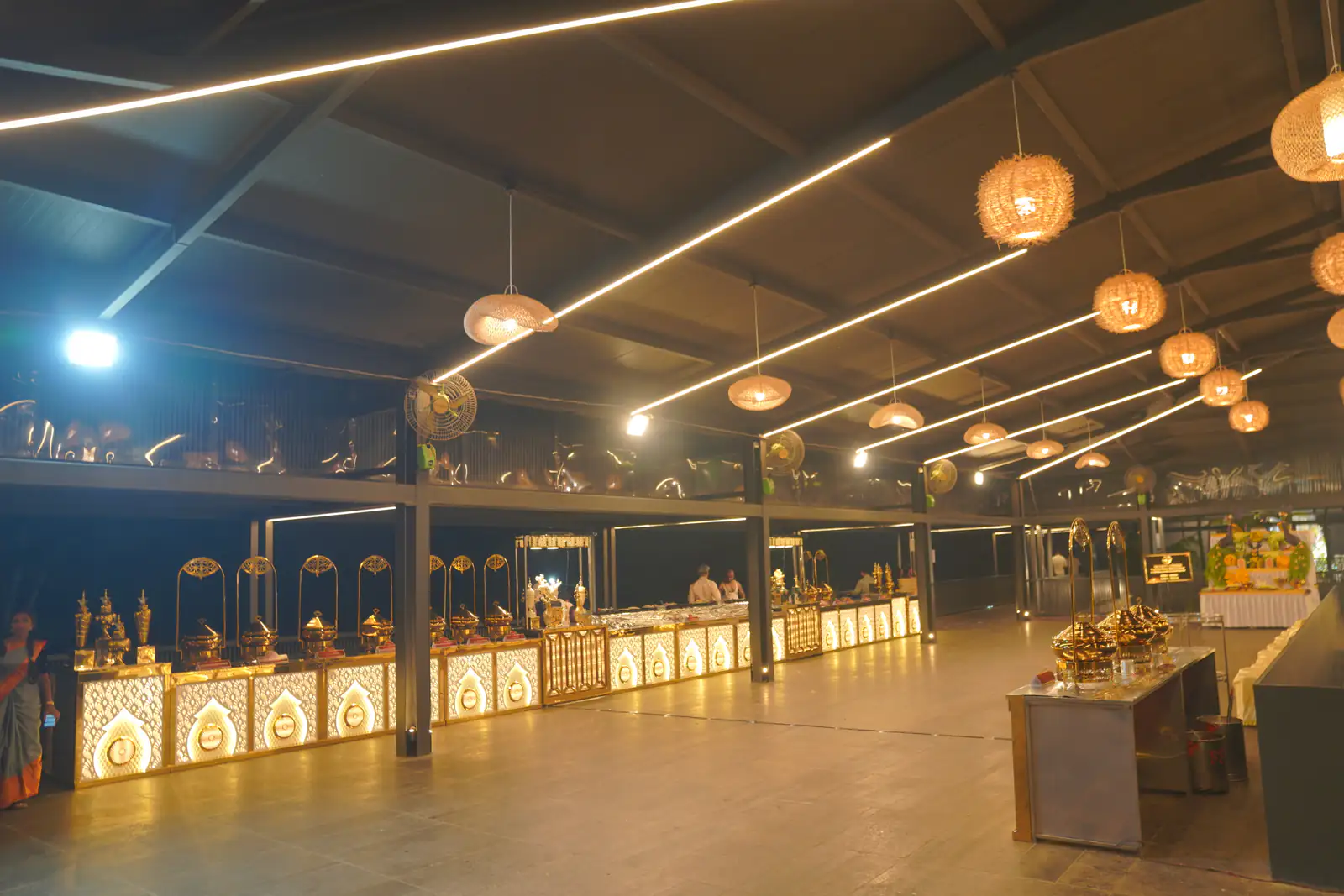 Buffet line under woven lamps